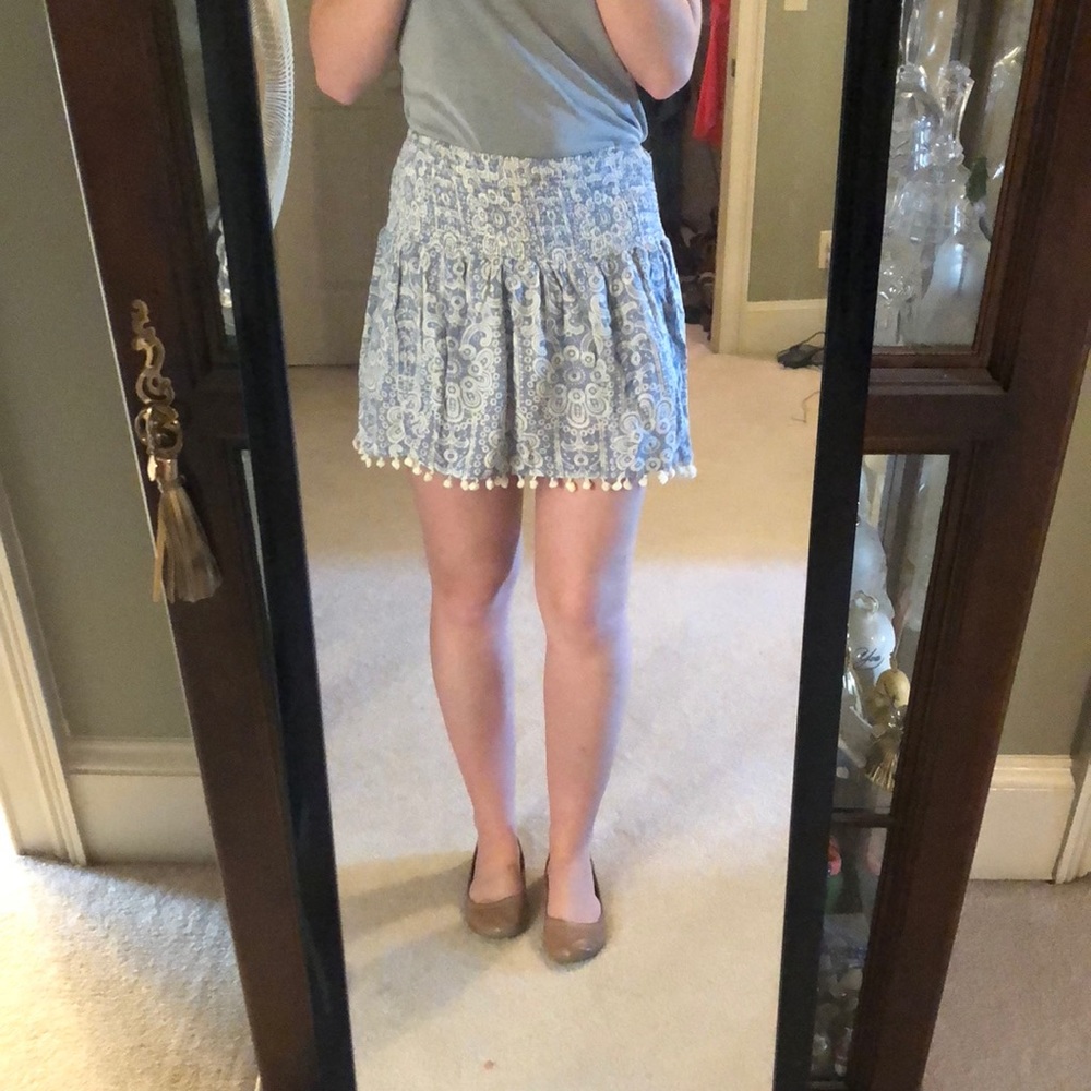 Blue flowered skirt with tiny Pom Poms on edges